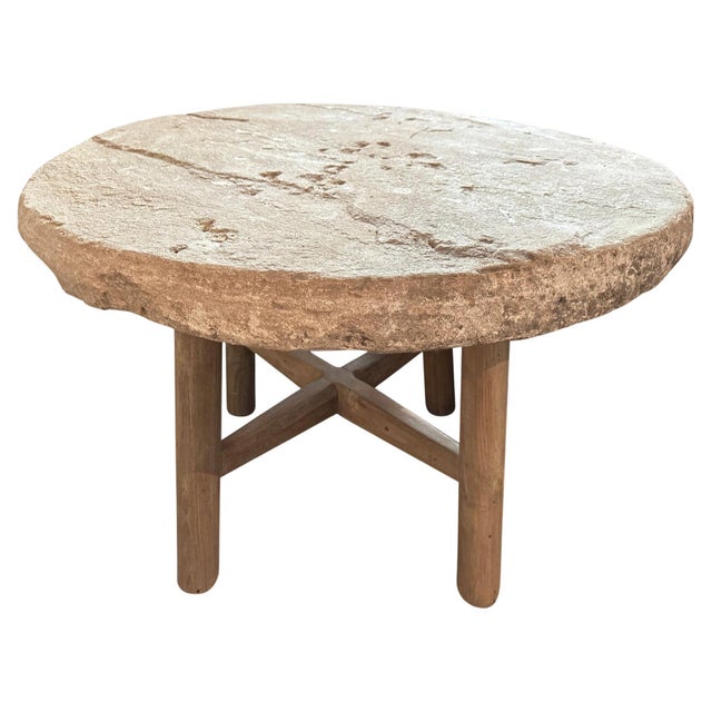 Impressive 3.5" thick antique stone from the island of Sumba. Set on a teak wood minimalist base. Perfect as a side table,...
