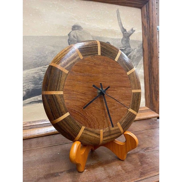 Sleek Wooden Wall Clock with Different Wood Textures. Stand Not Included. Operational Ability Unknown . Vintage Condition...