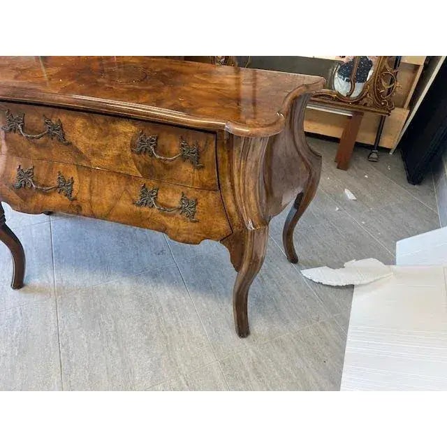 This exquisite piece of furniture is a Walnut Italian Shest of Drawers, also known as a Commode. It features two spacious...