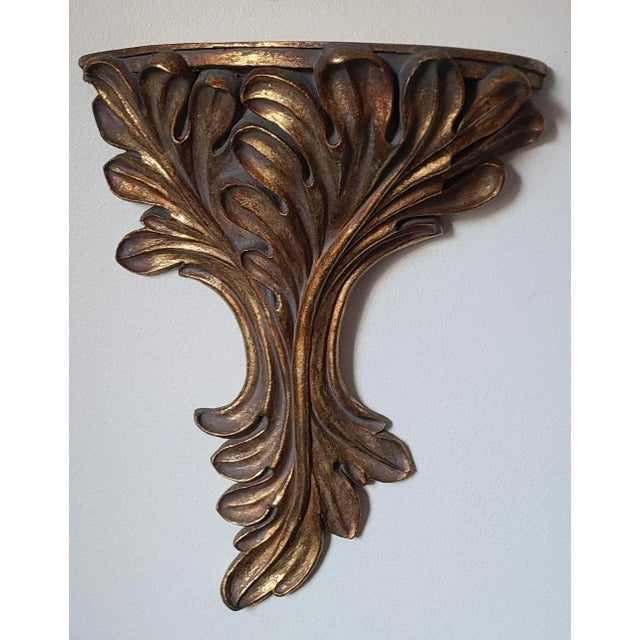 Here is a rather large-scale wall sconce in antique gold finish and acanthus leaf motif. Heavy, substantial and timeless....