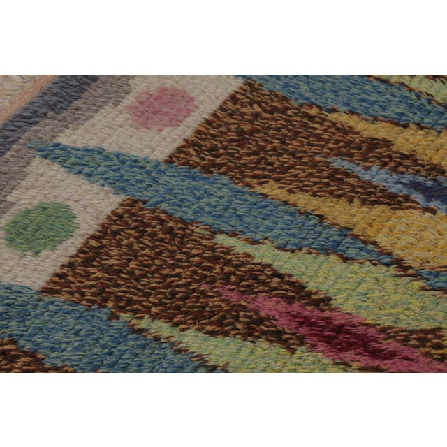 Hand-knotted in lush, high-pile wool in Sweden circa 1960-1970, this 3x4 vintage Swedish Rya rug is a bold new addition to...