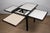 Elegant and ingenious, this dining table designed by Bernard Vuarnesson captivates with its architectural design and...