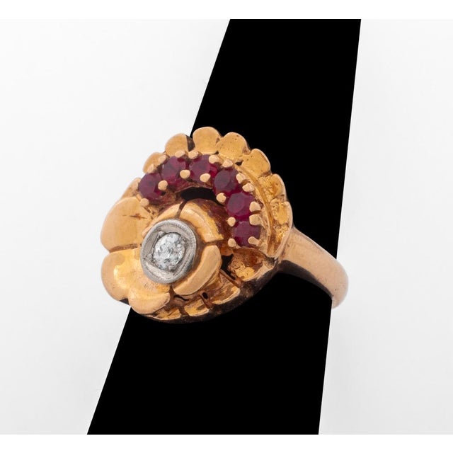 14K rose gold and white gold ruby diamond ring, featuring 6 prong set round rubies weighing a total of approx. 0.42 carat...