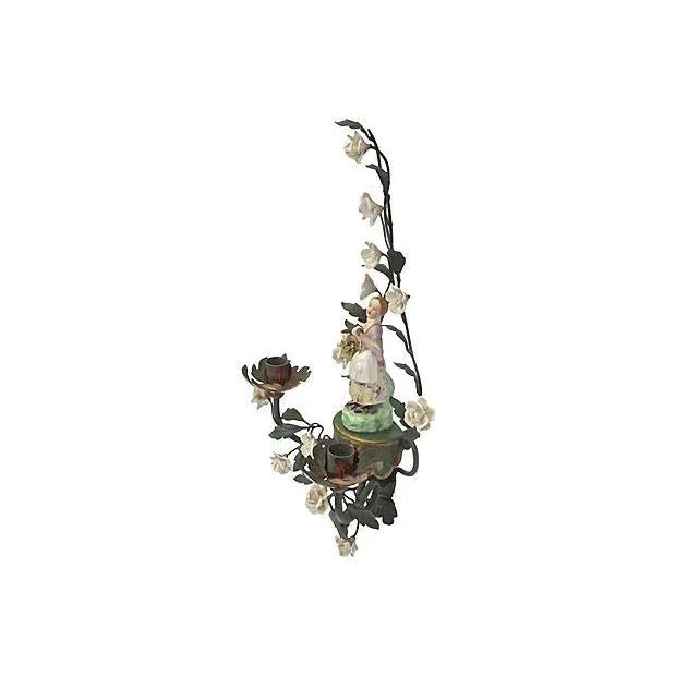 Antique; 19th century, French, tole and porcelain, floral, candle sconce with mounted porcelain maiden figurine at center....
