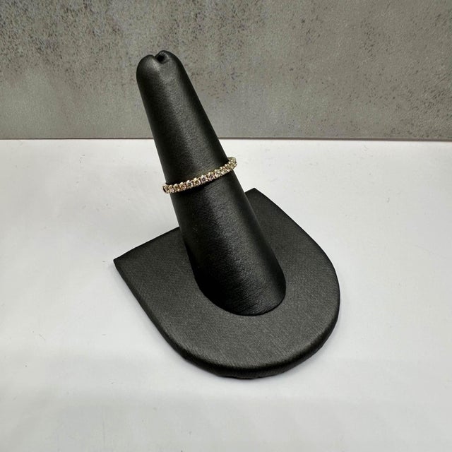 This beautiful Diamond Half Eternity Ring in 14kt yellow gold features 0.25ctw of natural IJ SI round diamonds, creating a...