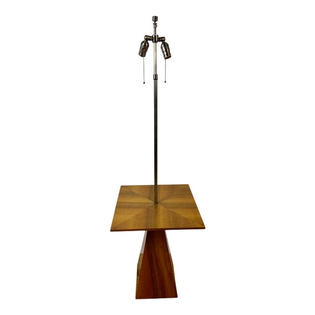 Harvey Probber walnut veneer lamp table. Table top has pie cut veneer surface supported by pyramid shaped base. Hardware...