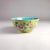Vintage Chinese Export porcelain rice bowl decorated with a floral frieze on a yellow ground in on-glaze enamels with an...