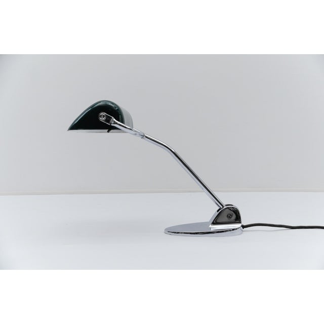 Chrome Bauhaus banker's lamp with green enamel by Jacobus, 1930s The height when fully lowered is 25 cm; when raised, it...