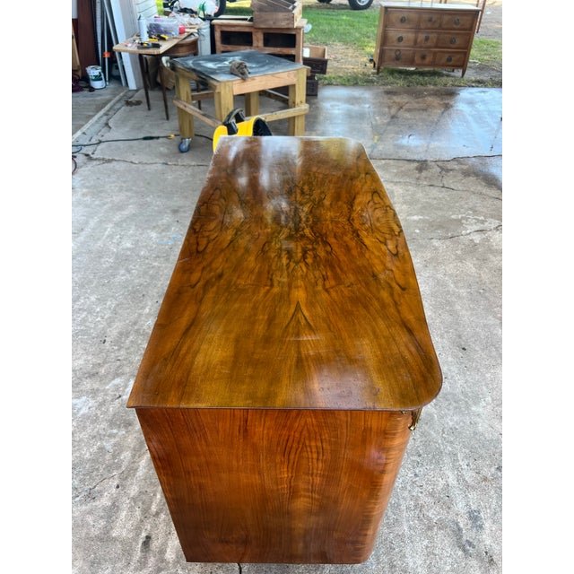 A refined French Art Deco commode crafted in the 1930s from rich walnut, showcasing the clean lines and elegant...