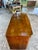 A refined French Art Deco commode crafted in the 1930s from rich walnut, showcasing the clean lines and elegant...