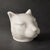 An unusual and highly decorative art deco ceramic piggy bank in the form of a stylized panther head, produced by l&v ceram...