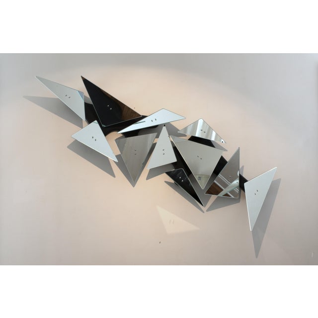 Mirror No. 6 is a large-scale reflective wall object designed by Chris Delmar. Rather than functioning as a conventional...
