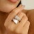 Elevate your jewelry collection with this beautifully crafted sterling silver bypass ring, designed to embody both modern...