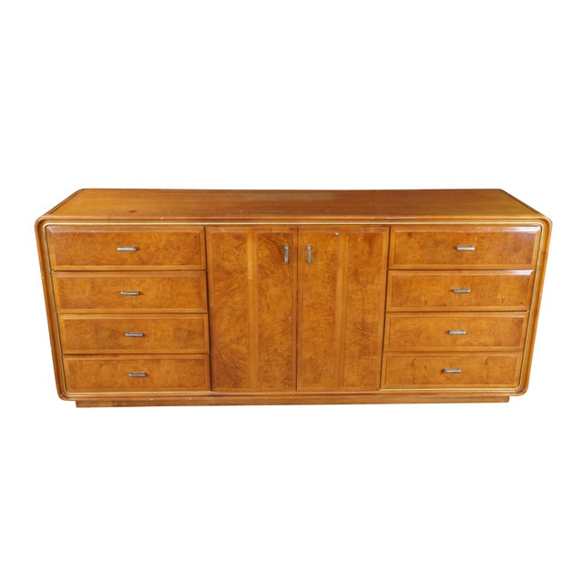 This American of Martinsville dresser is a striking example of Hollywood Regency design with Art Deco influences, circa...