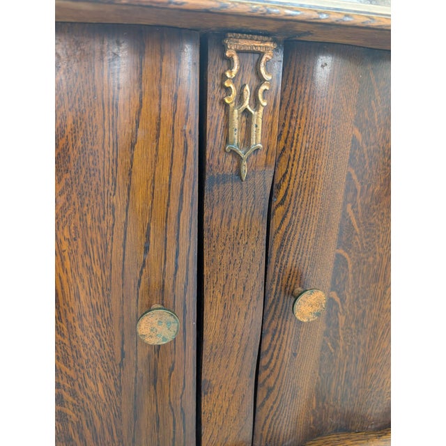 Art Deco Oak and Marble Sideboard Stylish Art Deco marble and oak sideboard. The solid oak construction and beautiful...