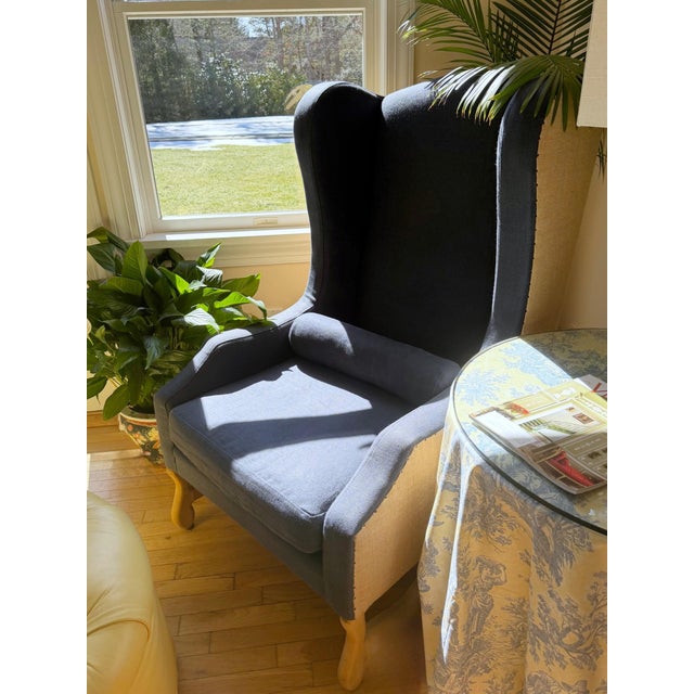 Wingback Chair in Navy Blue Linen by Restoration Hardware Wrapped in navy blue linen that understands lighting better than...