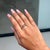 This Antique style signet ring showcases a 0.62 carat natural pear cut pink sapphire, set in 14K yellow gold. The sapphire...