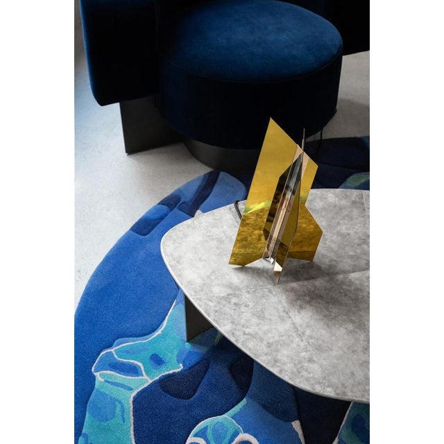 Geometric flare 04 table lamp by jennifer midoz dimensions: d 22,5 x w 31,5 x h 37,5 cm materials: polished brass color...