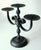 This three-armed handmade candle holder made of heavy wrought iron dates from the 1950s and bears the characteristic...
