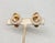 1962 goldtone cut faceted glass beads in the shape of a figure 8 clip earrings. Marked "NAPIER PAT. PEND." on the clips....