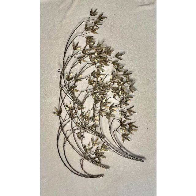 Mid Century Modern Curtis Jere Metal Art Sculpture of Windswept Gold Bamboo Leaves, signed. Three loop hooks on back for...