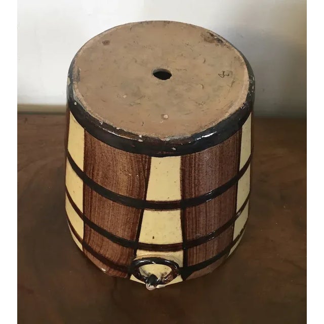 Antique 19th century French faux bois barrel form terra cotta flower pot jardiniere with ring handles. Hand painted to...