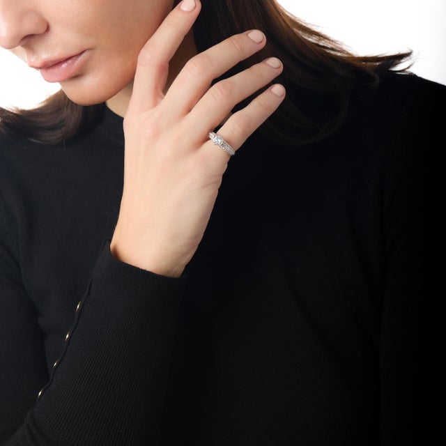 This radiant vintage engagement ring is a beautiful expression of classic elegance with a refined 1990s sensibility. At...