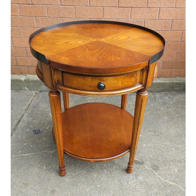 Late 20th Century Bookmatched Single Drawer Fruitwood Gueridon Table in the style of French Louis XV. Measures 22.25" in...