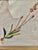 This product is an embroidered floral botanical vintage art piece featuring a linen material with a gold frame, measuring...