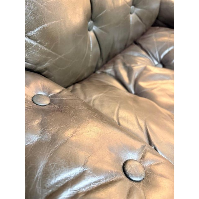 Elevate your living space with this striking pair of 1970s scandinavian modern lounge chairs and matching footstool,...