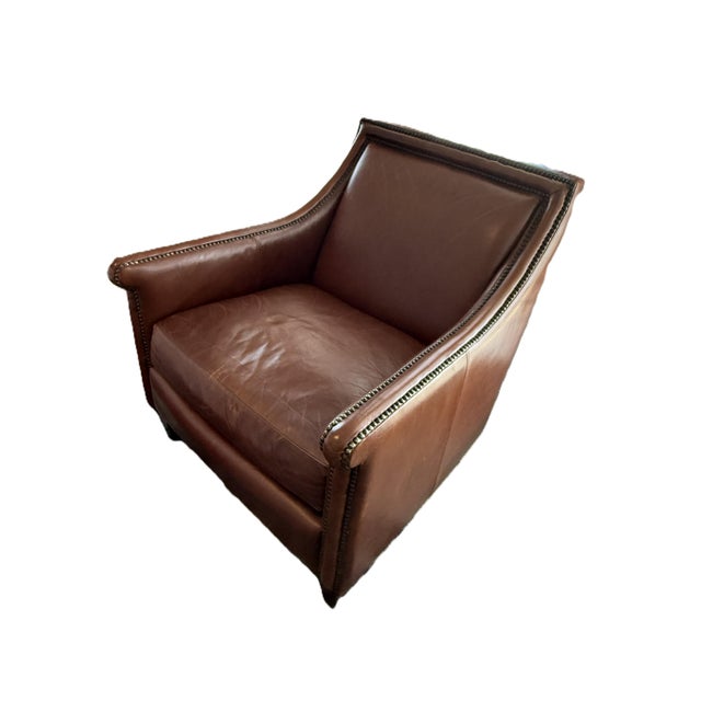 A classic Bernhardt leather club chair featuring rich brown leather, elegant nailhead trim, and timeless craftsmanship....