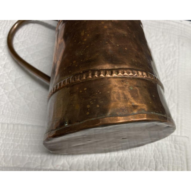 Primitive Rustic Hand-Hammered, Forged Copper Pitcher, 9.25" High A very interesting primitive Copper Pitcher with a great...