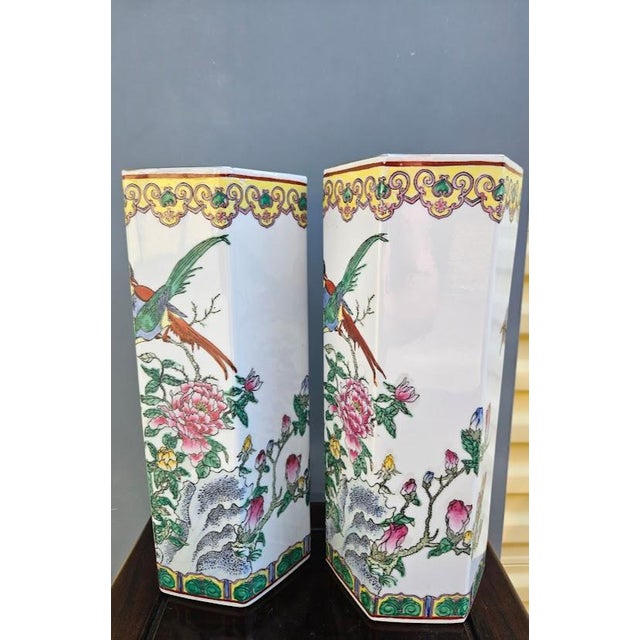 Pair of vintage Chinese Export porcelain vases. Featuring a classic, structured hexagonal faceted form, these decorative...