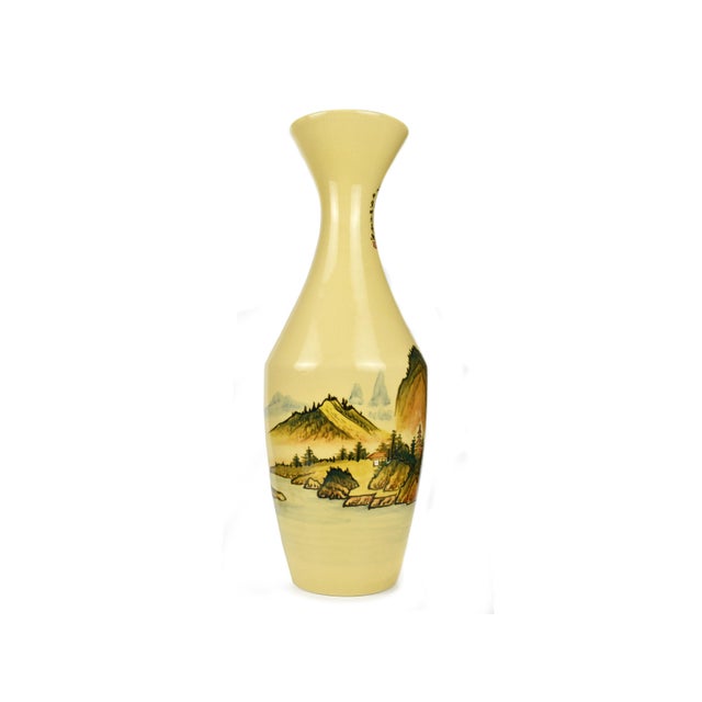 This striking mid-century Chinese porcelain vase features a vibrant mustard-yellow glaze accented by a classic crackle...