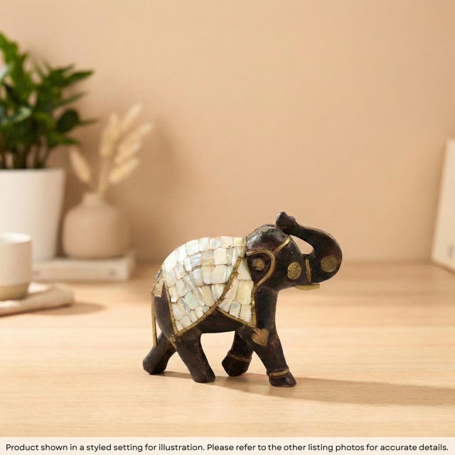 Invite the majestic spirit of the East into your home with this exquisite Hand Carved Wooden Elephant Statue. Inspired by...