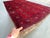 A rare vintage Afghan Turkmen room rug in the prized "garden compartment" format — 18 rectangular panels organized in...