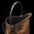 This is an antique coal scuttle. A Scottish, hand-beaten copper fireside bin in Aesthetic Period taste, dating to the...
