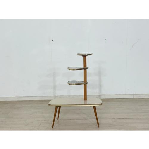For sale is a beautiful mid-century modern plant stand from the 1960s, designed as a classic tiered display. This piece of...