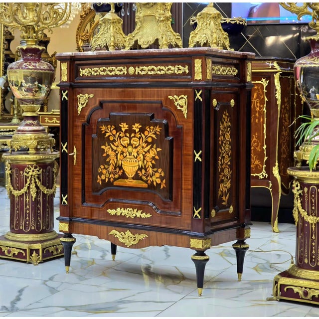 Bring timeless French sophistication into your home with this elegant French Louis XVI Accent Cabinet, masterfully...