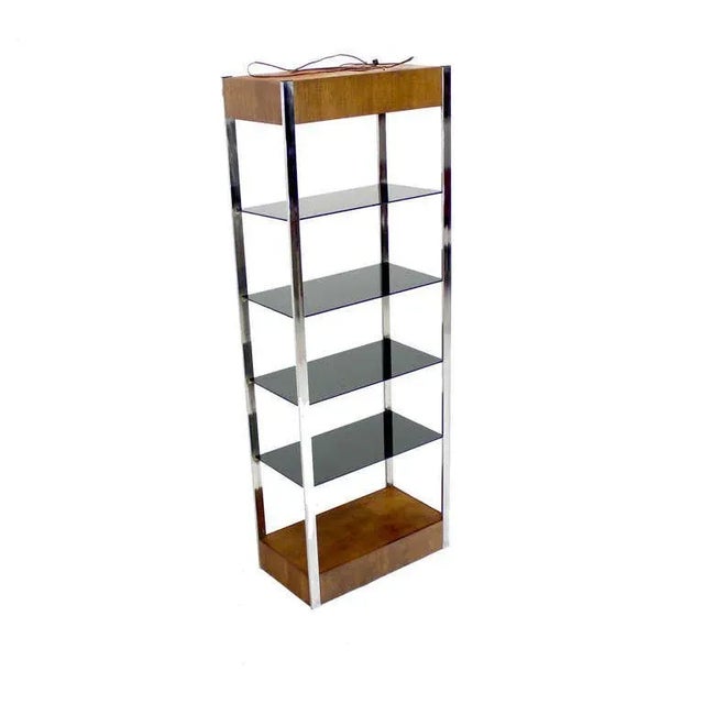 Etagere This Chrome and Walnut Etagere c1970s, is made with burl and chrome, features smoked glass shelves.