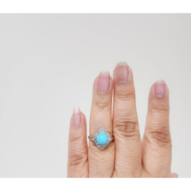 Beautiful 2.12 ct. turquoise oval cabochon with 0.78 ct. good quality white diamond baguettes. Handmade in platinum. Ring...