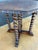Elegant octagonal side table crafted in solid wood, featuring five richly carved barley twist legs united by a cross-...