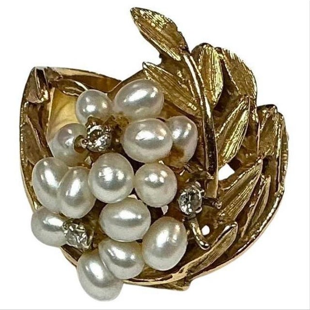 Impressive 1950's retro 14K Yellow Gold Cocktail Ring. Ring has Leaf Motif and Seed Pearls with Three Accent Diamonds....