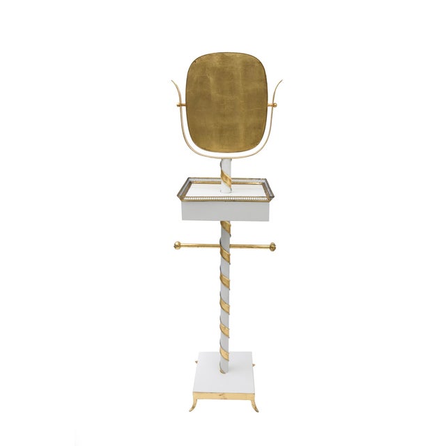 This very unusual mid century modern signed Italian tall swivel mirror stand by Mingazzi has brass metal trim, gold leaf...