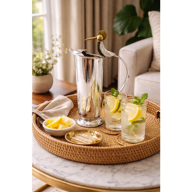 A striking example of Mexican Modernism from the renowned Los Castillo workshop in Taxco, this sculptural silver-plated...