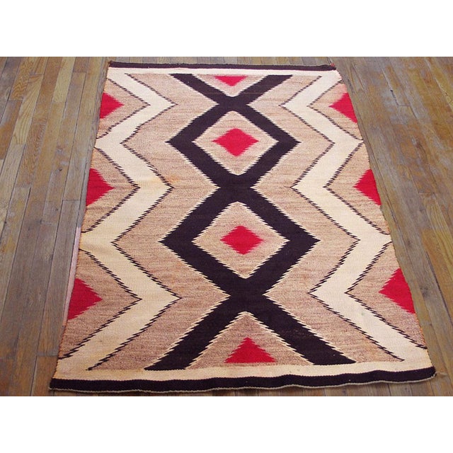 Antique Wool Brown Earth Tone Flat Weave Rug, Circa Date: 1930s. This exceptional textile exemplifies the powerful...