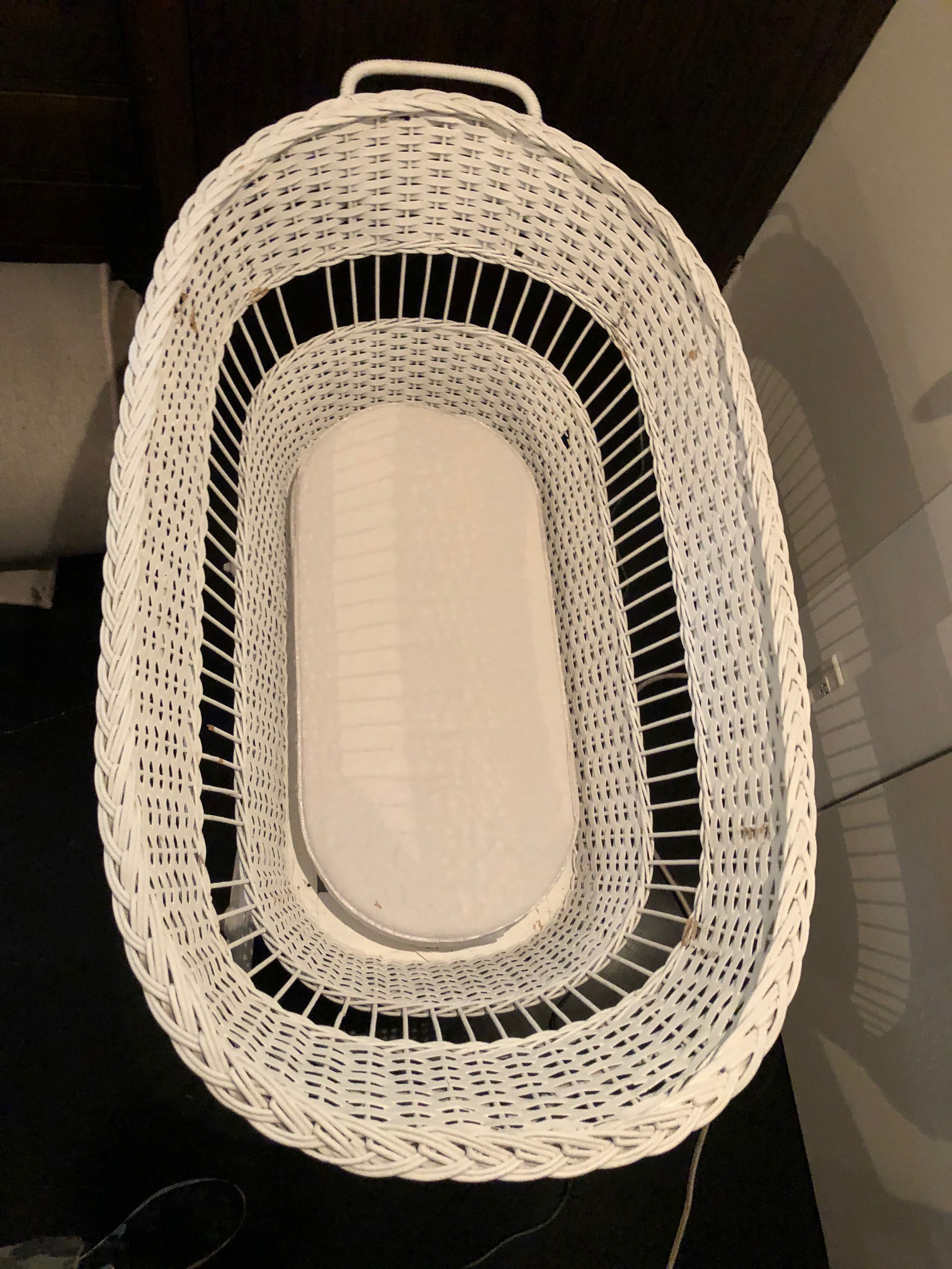 antique wicker baby bassinet on wheels