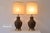 Absolutely gorgeous pair of vintage mid century ceramic lamps with relief art mimicking sgraffito woodwork. The lamps are...