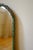 Circa 1950s Swedish Modern Green painted Wall Mirror with sculptured organic details around the frame and a woman depicted...