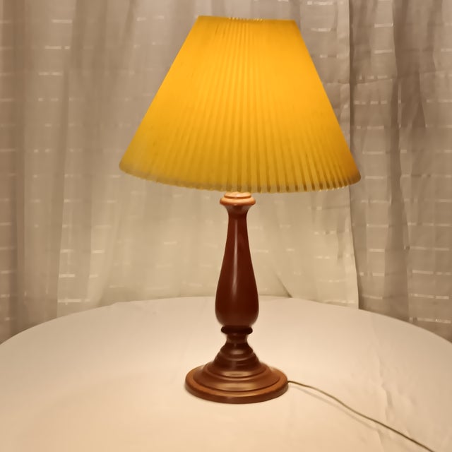 Vintage Solid Wood Mid Century Modern Lamp with a beige lamp shade sprinkled with dark brown accent. Working condition and...